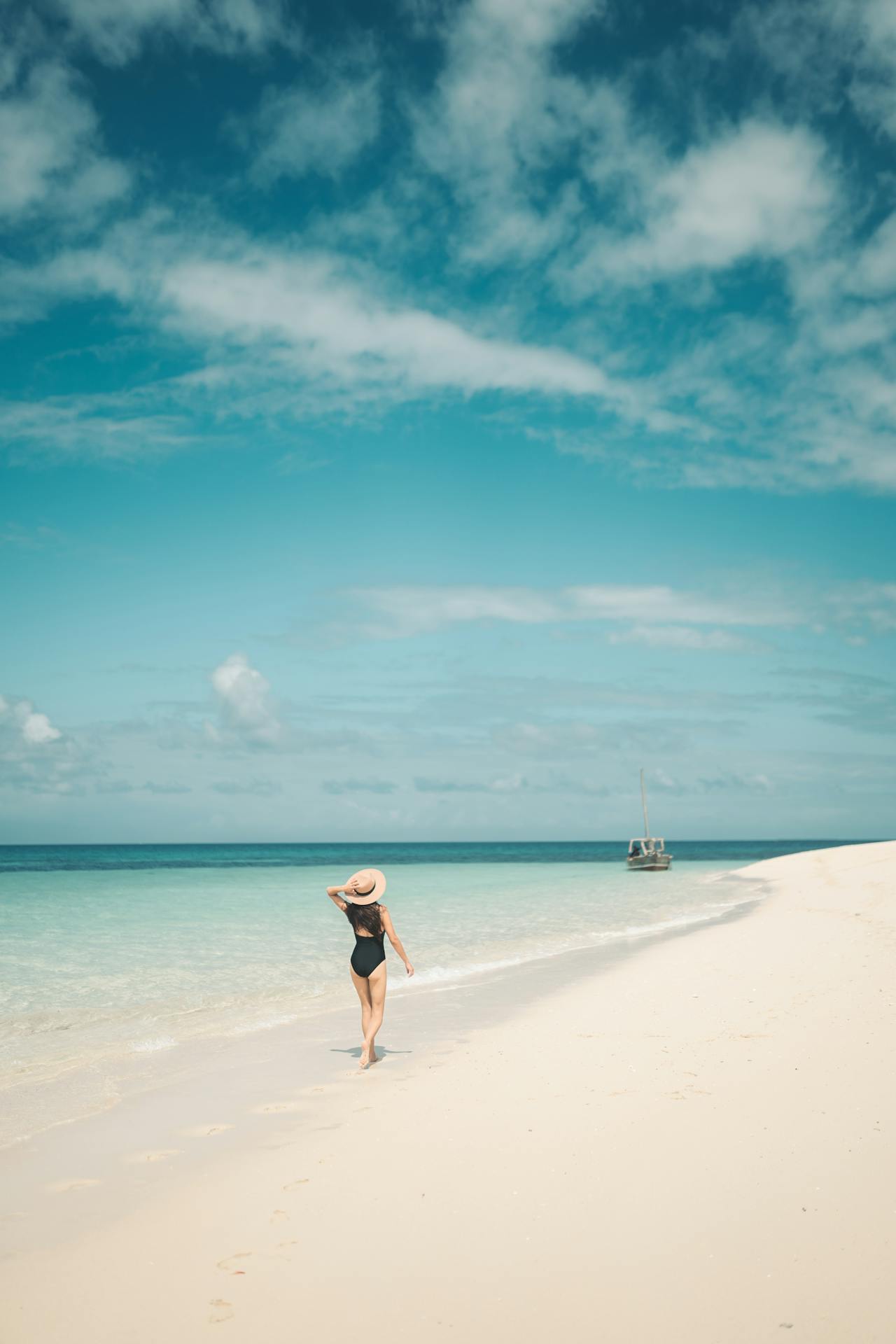 Woman walking by the shore